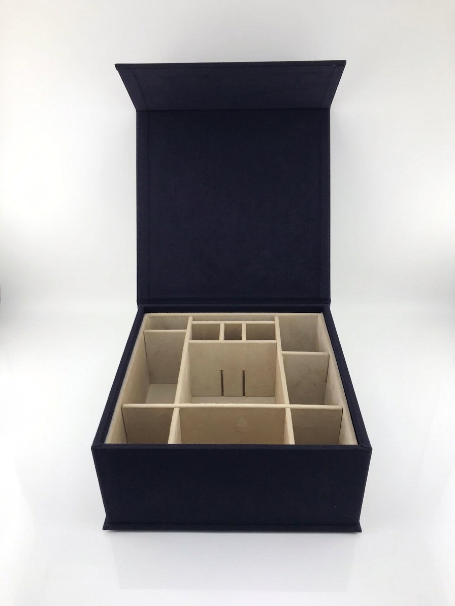 Custom suede rigid box with gold foil logo stamping front view by Luxe Box
